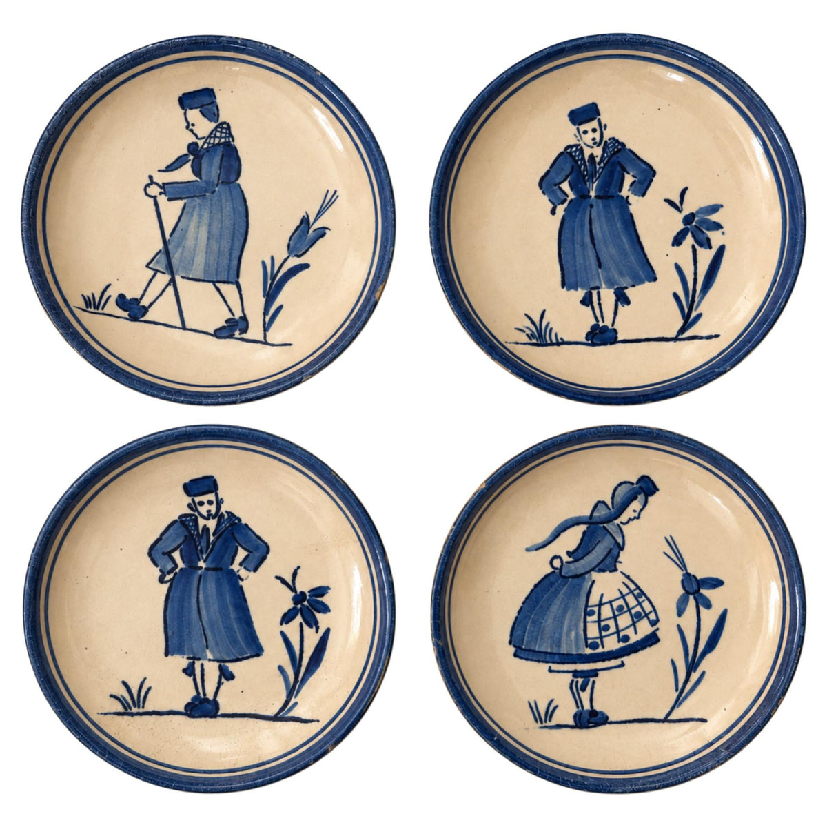 Set of Four Antique German Butter Pats with Blue Dutch Figures on a Pink Ground