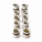 Ten White Handleless Restaurantware Creamers with Bands and Lines