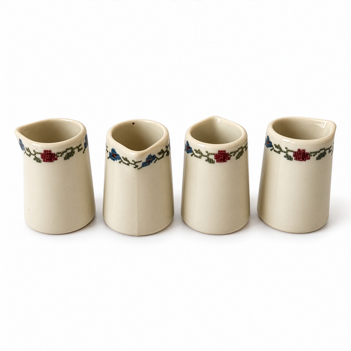 Set of Four Shenango Ivory Creamers, Needlepoint Design