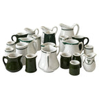 Collection of 24 Green and White Restaurantware Creamers