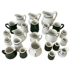 Collection of 24 Green and White Restaurantware Creamers