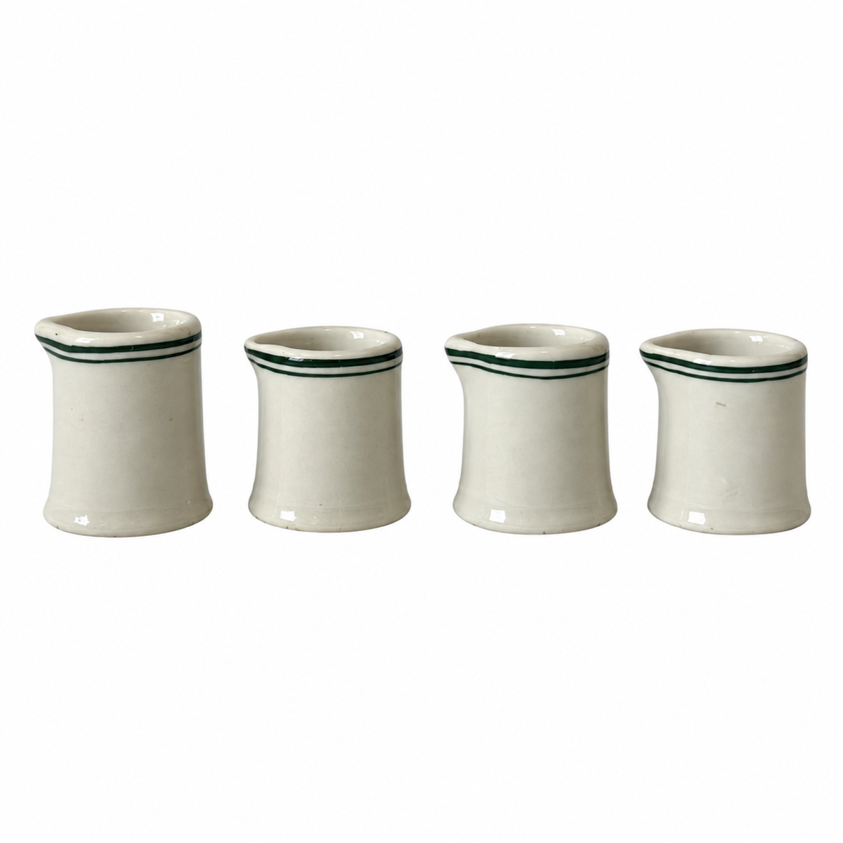 Collection of 24 Green and White Restaurantware Creamers