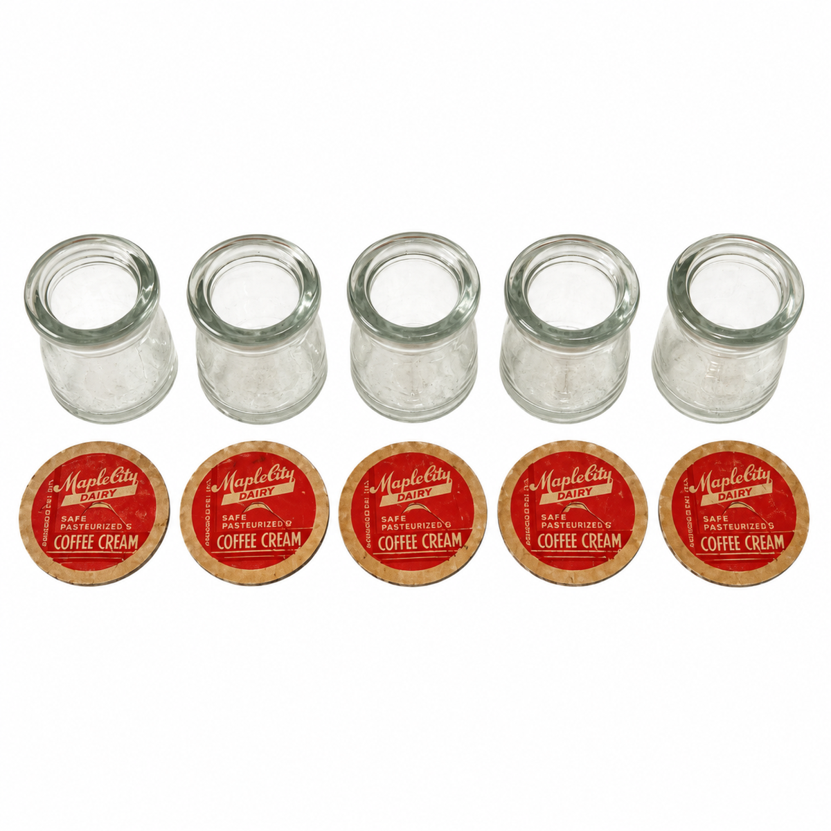 Collection of 27 Clear Glass Creamers with Maple City Dairy Caps