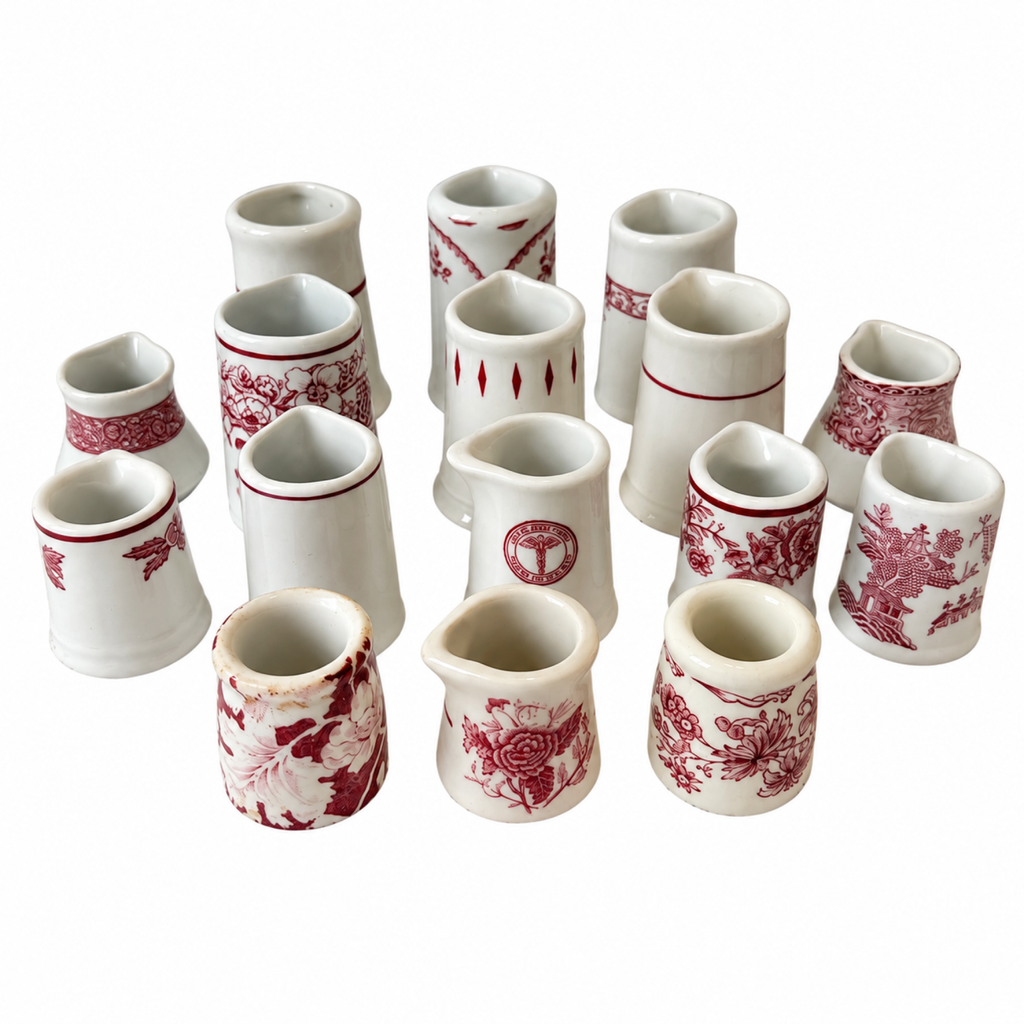 Collection of 19 Handleless Restaurantware Creamers in White and Red