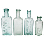 Set of Four Antique American Medicine Bottles in Aqua Glass