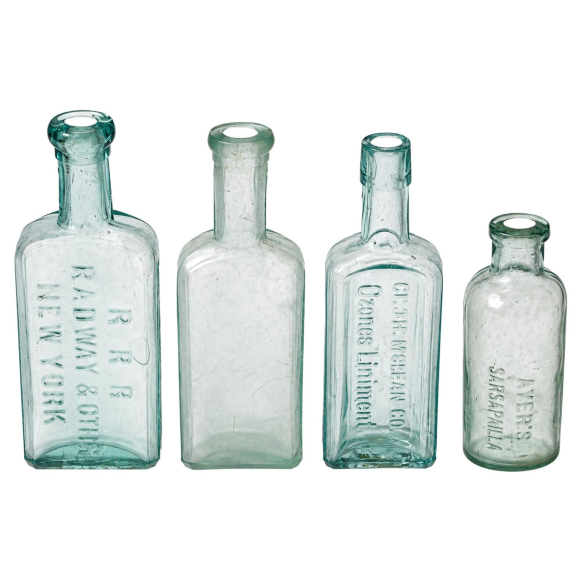 Set of Four Antique American Medicine Bottles in Aqua Glass
