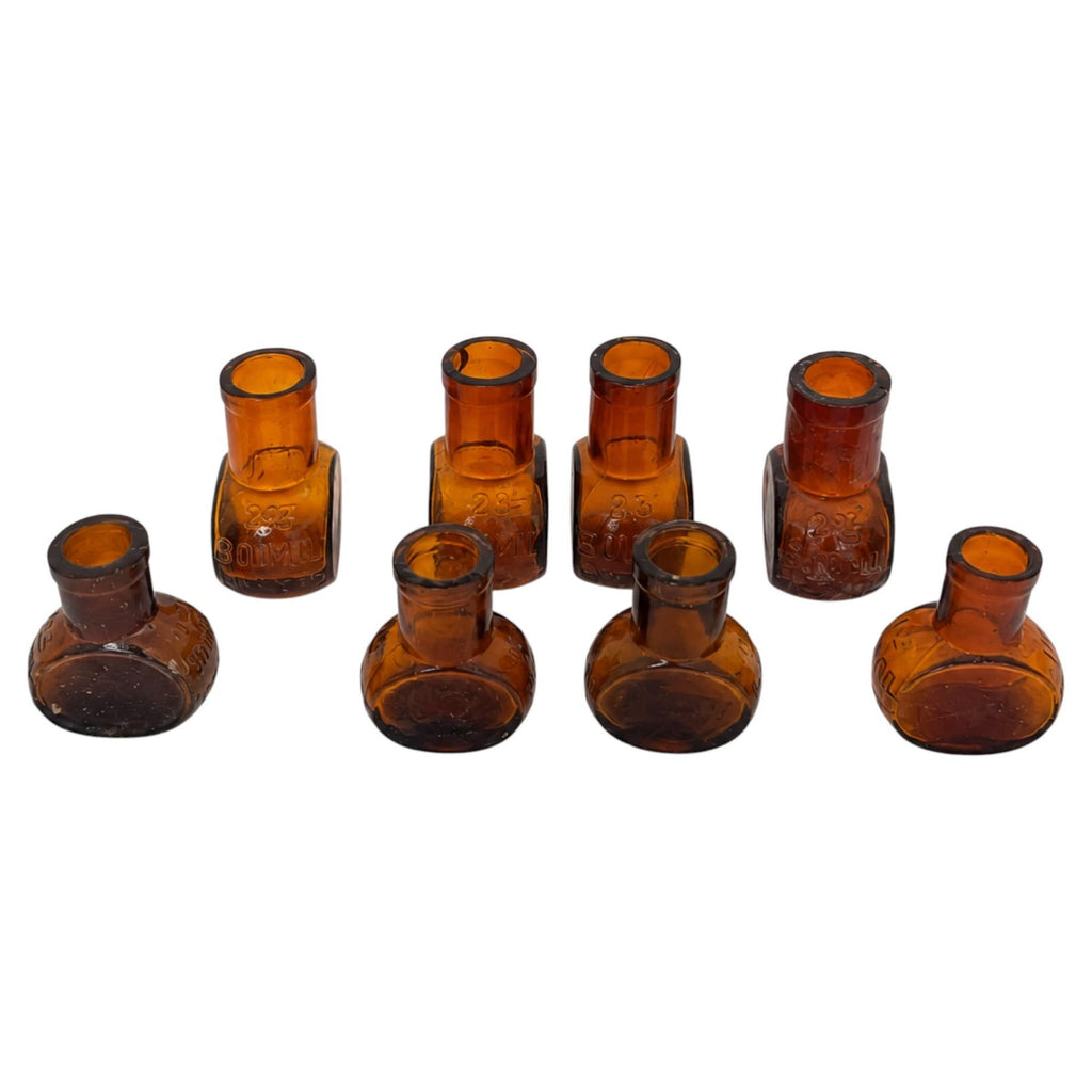 Collection of 8 Antique Bovril Amber Glass Bottles