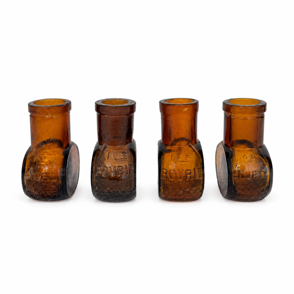 Collection of 8 Antique Bovril Amber Glass Bottles