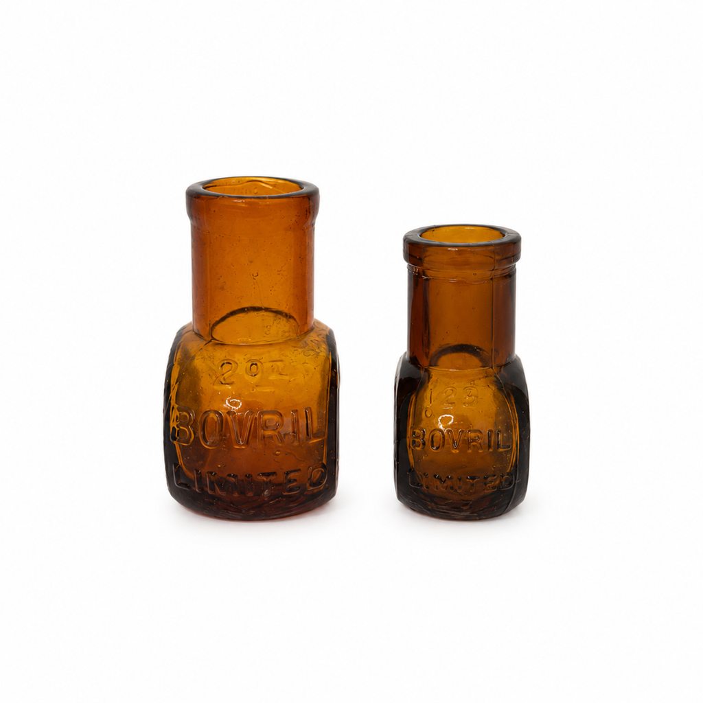 Collection of 8 Antique Bovril Amber Glass Bottles