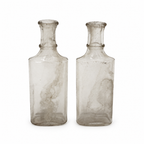 Collection of 24 Early 20th-Century Clear Glass Apothecary and Laboratory Bottles