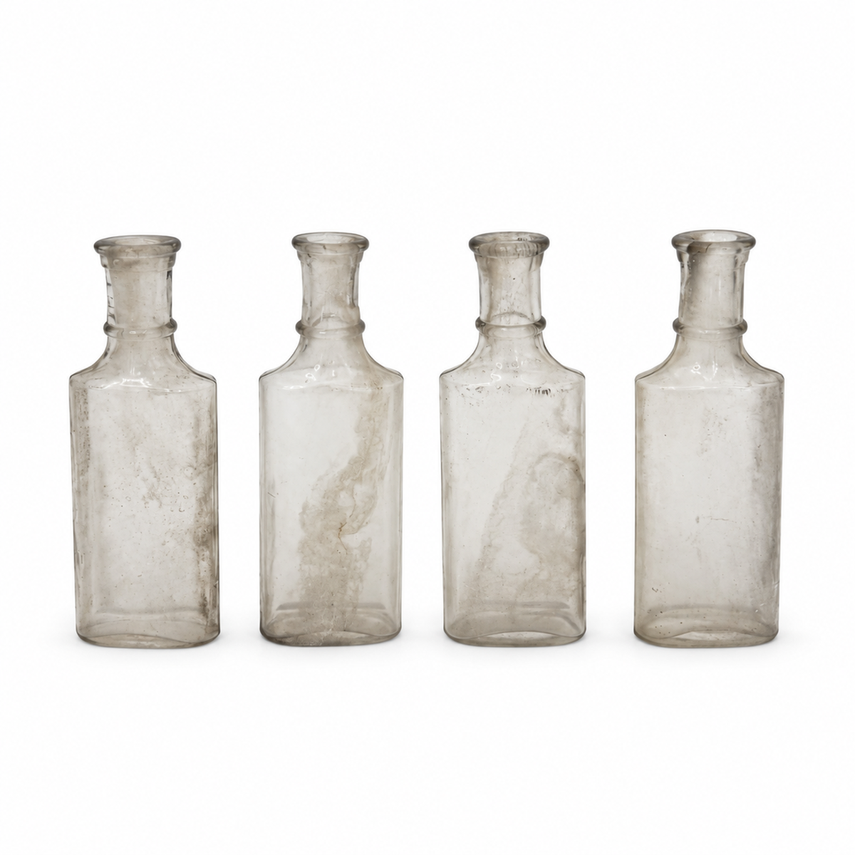 Collection of 24 Early 20th-Century Clear Glass Apothecary and Laboratory Bottles