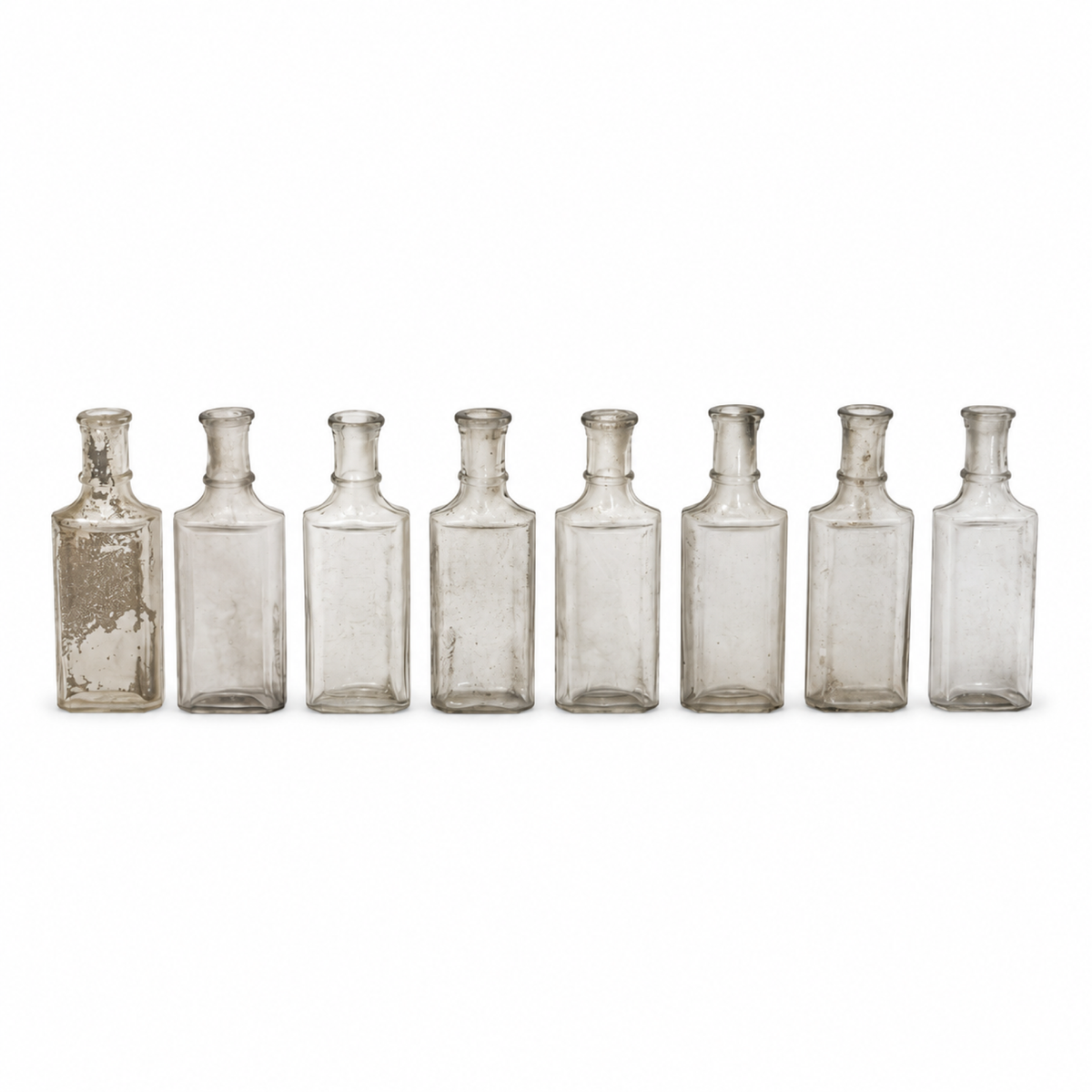 Collection of 24 Early 20th-Century Clear Glass Apothecary and Laboratory Bottles