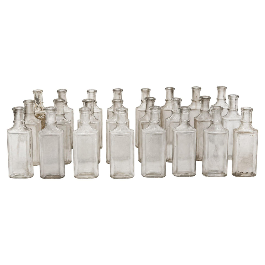 Collection of 24 Early 20th-Century Clear Glass Apothecary and Laboratory Bottles