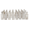 Collection of 24 Early 20th-Century Clear Glass Apothecary and Laboratory Bottles