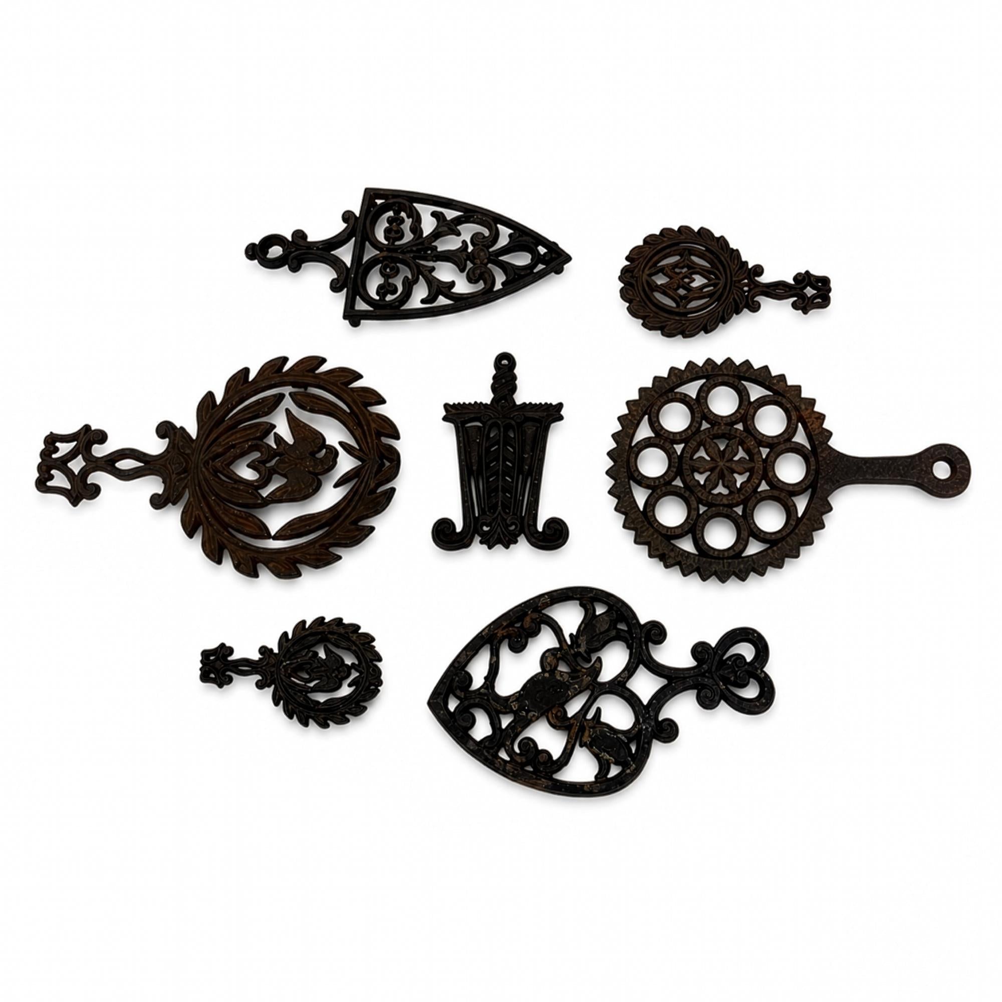 Set of 7 Vintage Cast Iron Wall Sculptures, Decorative Trivets — image 2