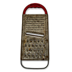 Wall Installation of Eleven Antique and Vintage Metal Kitchen Graters — image 8