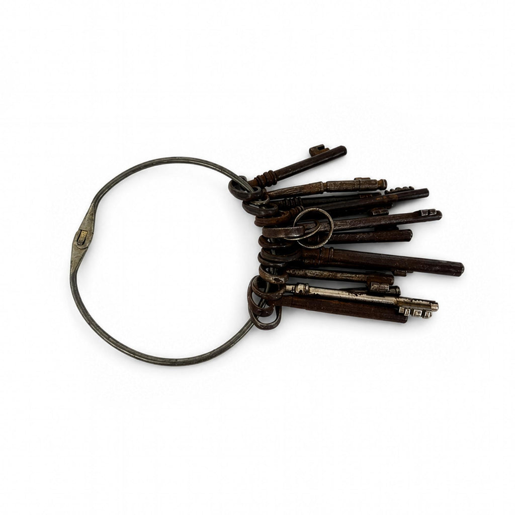 Set of 13 Antique Iron Skeleton Keys on Keeper's Ring, circa 1900