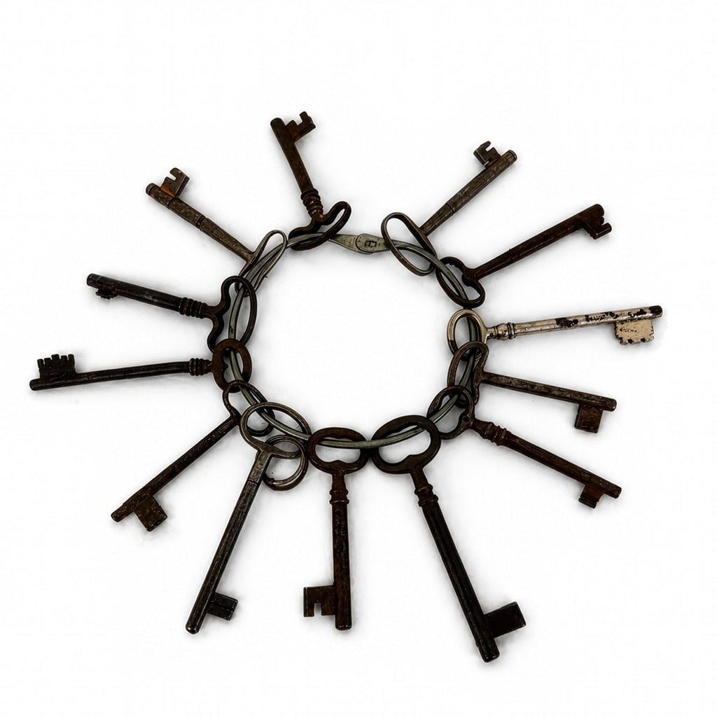 Set of 13 Antique Iron Skeleton Keys on Keeper's Ring, circa 1900