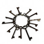 Set of 13 Antique Iron Skeleton Keys on Keeper's Ring, circa 1900