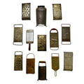 Wall Installation of Thirteen Antique and Vintage Metal Kitchen Graters