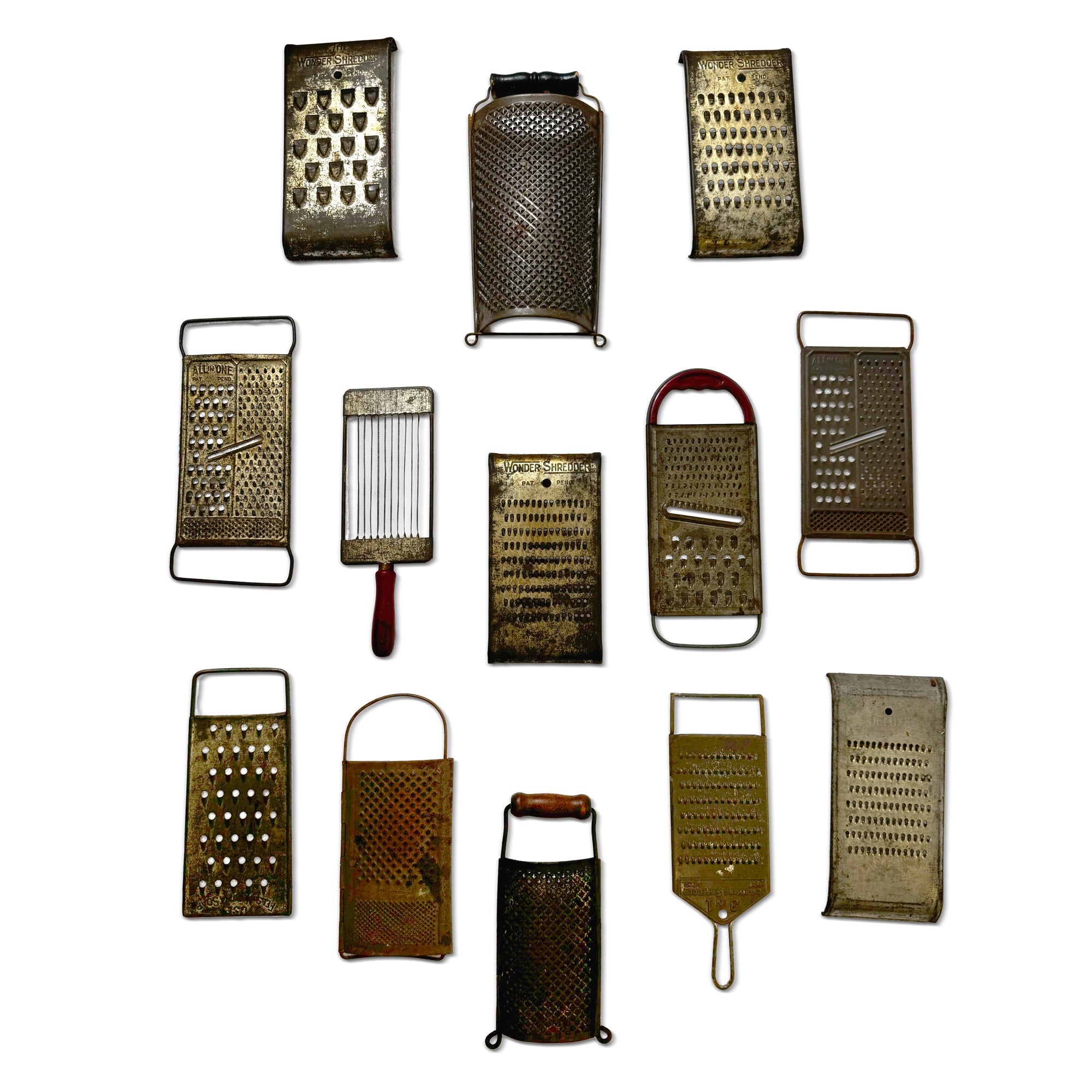 Wall Installation of Thirteen Antique and Vintage Metal Kitchen Graters