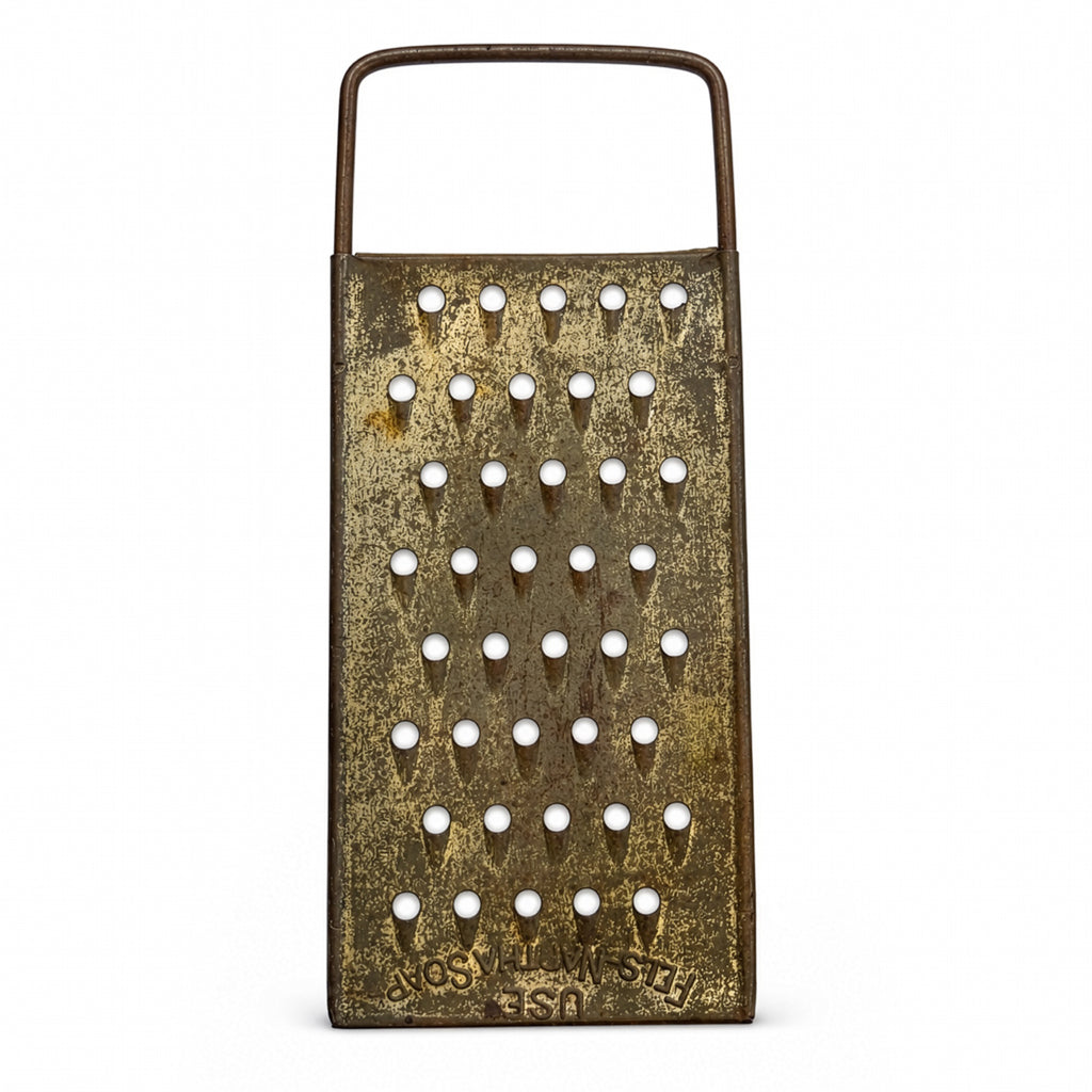 Wall Installation of Thirteen Antique and Vintage Metal Kitchen Graters