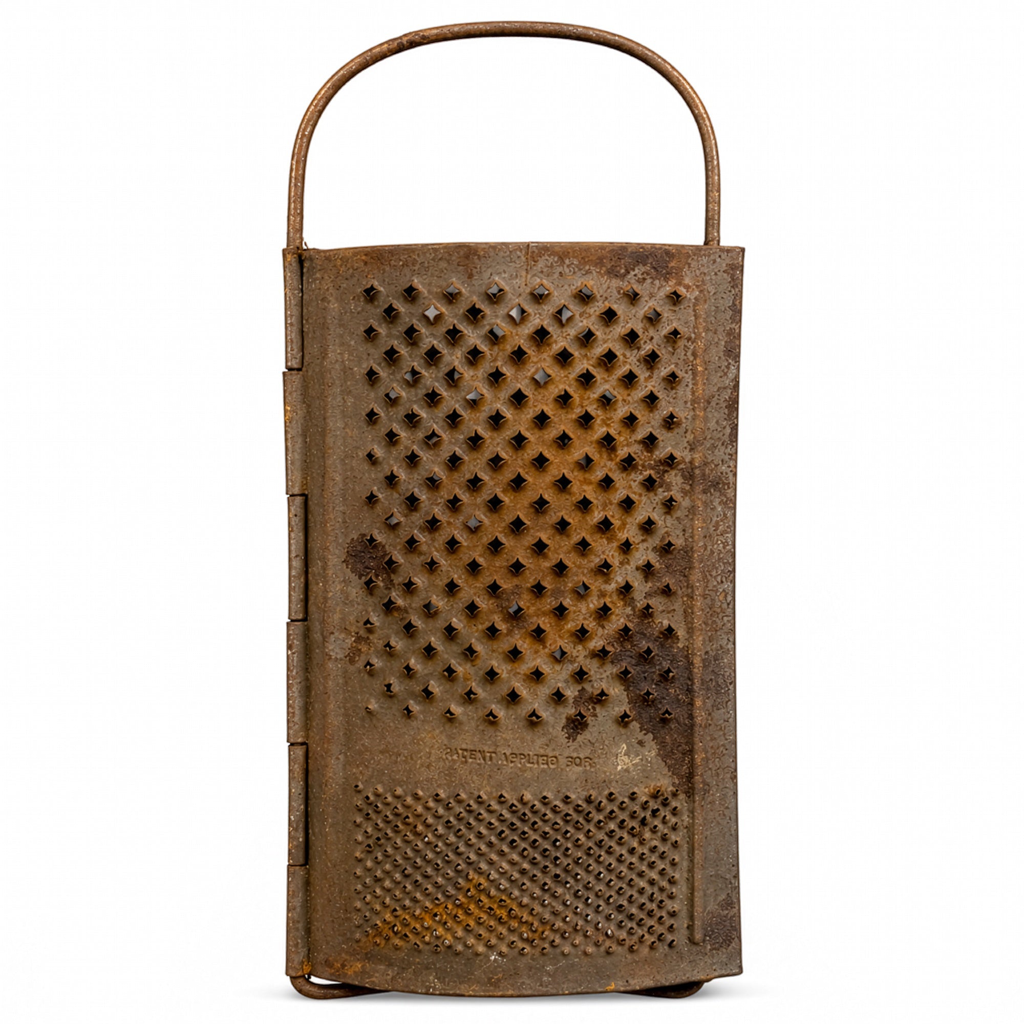 Wall Installation of Thirteen Antique and Vintage Metal Kitchen Graters
