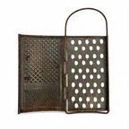 Wall Installation of Thirteen Antique and Vintage Metal Kitchen Graters