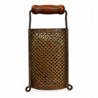 Wall Installation of Thirteen Antique and Vintage Metal Kitchen Graters