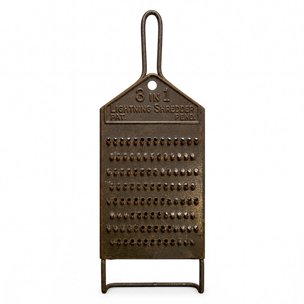Wall Installation of Thirteen Antique and Vintage Metal Kitchen Graters