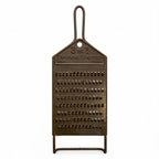 Wall Installation of Thirteen Antique and Vintage Metal Kitchen Graters