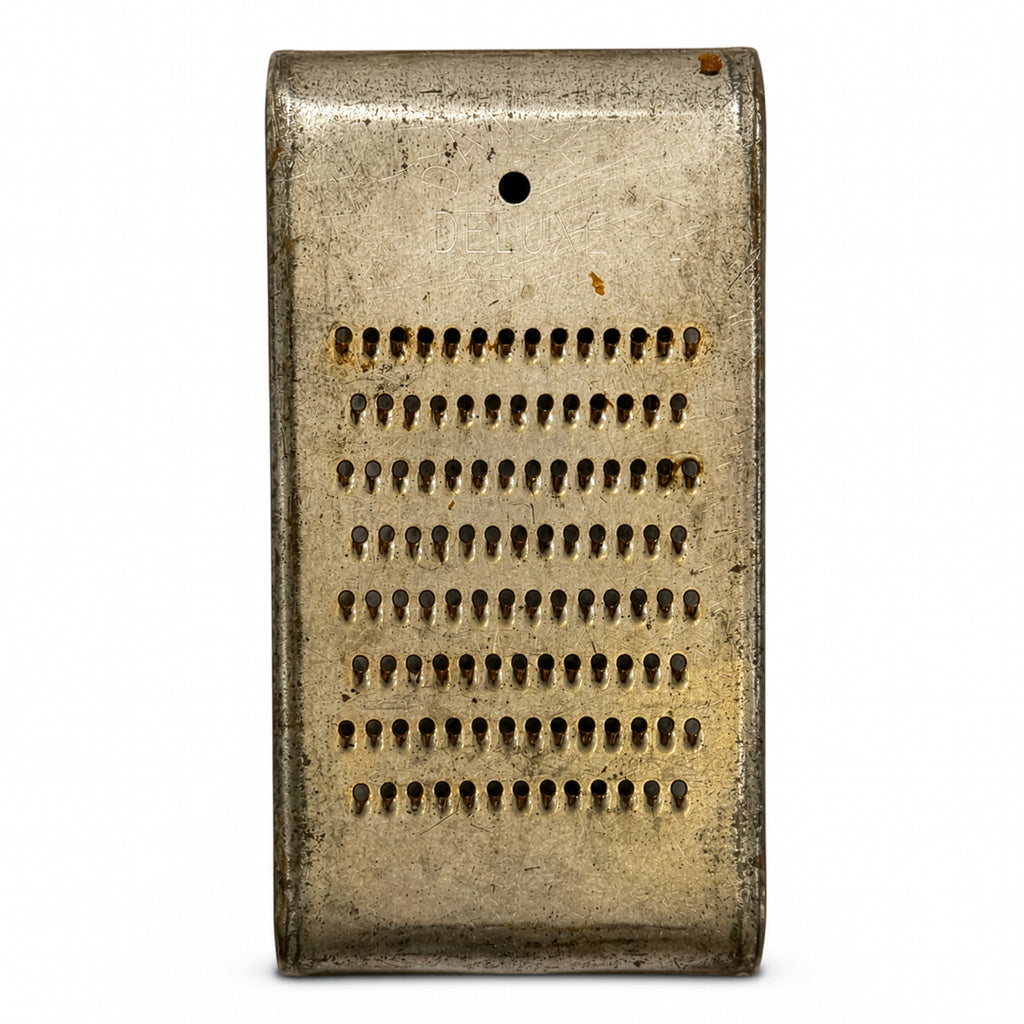 Wall Installation of Thirteen Antique and Vintage Metal Kitchen Graters