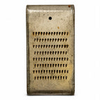 Wall Installation of Thirteen Antique and Vintage Metal Kitchen Graters