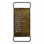 Wall Installation of Thirteen Antique and Vintage Metal Kitchen Graters