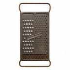 Wall Installation of Thirteen Antique and Vintage Metal Kitchen Graters