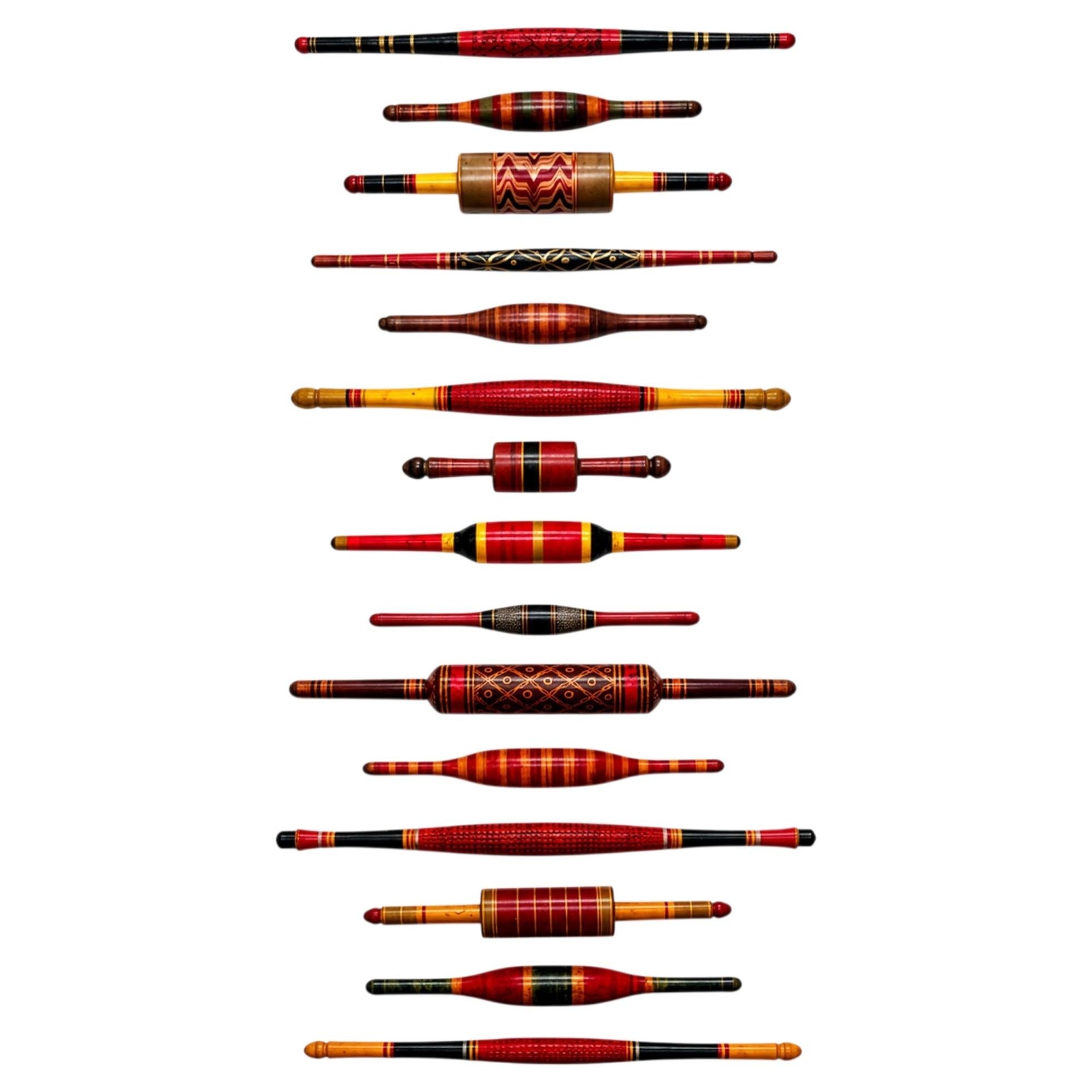 Wall Installation of Fifteen Vintage Indian Lacquered Wooden Rolling Pins