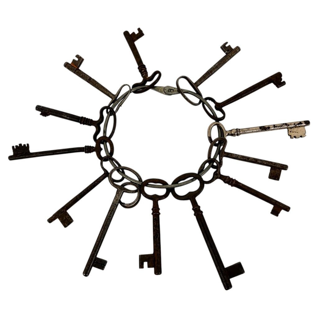 Set of 13 Antique Iron Skeleton Keys on Keeper's Ring, circa 1900